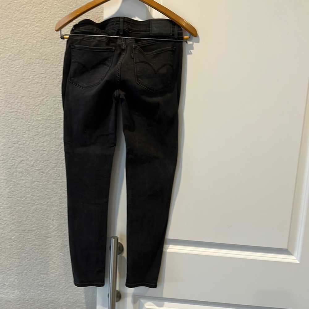 Levi’s faded black 711 skinny jeans